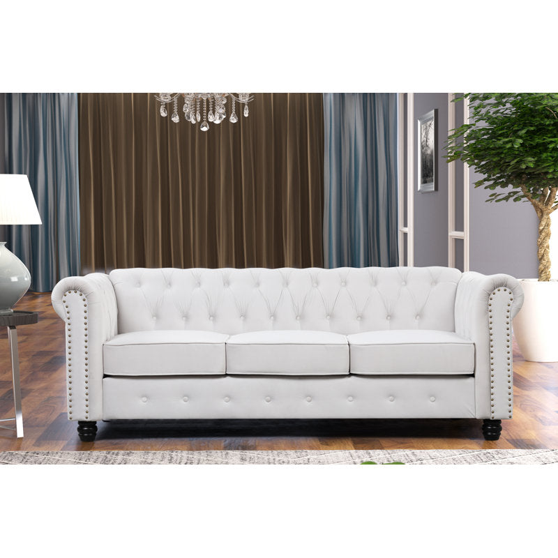 Luxury white Chesterfield 2 piece tufted sofa set of 5 with nailhead trim in elegant living room interior