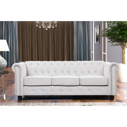 Luxury white Chesterfield 2 piece tufted sofa set of 5 with nailhead trim in elegant living room interior
