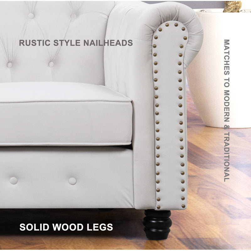 Luxury white Chesterfield 2 piece tufted sofa set of 5 with nailhead trim in elegant living room interior