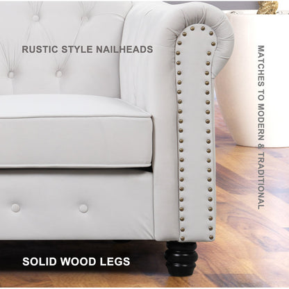 Luxury white Chesterfield 2 piece tufted sofa set of 5 with nailhead trim in elegant living room interior